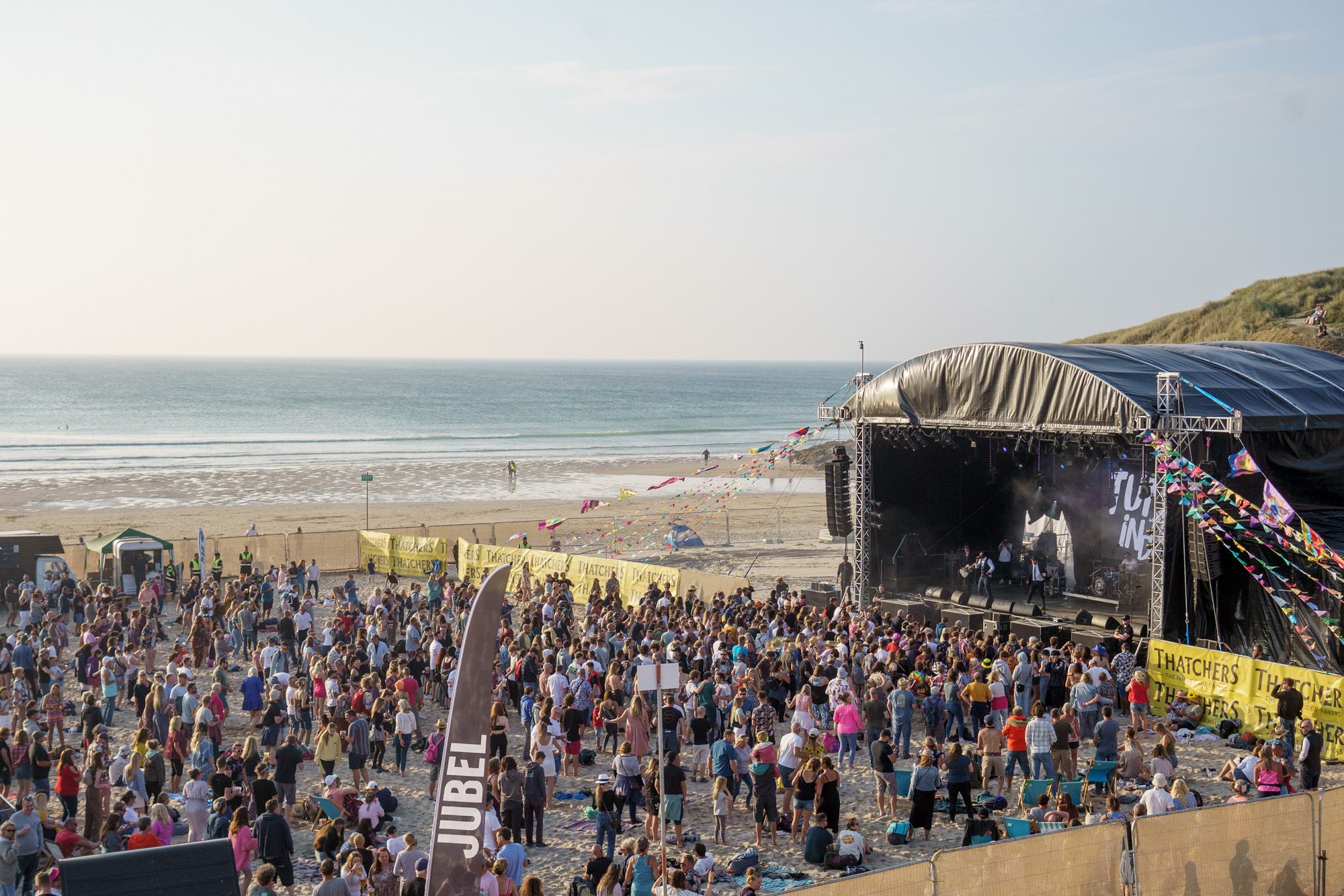A view of the Tunes in the Dunes festival from Perranporth sand dunes.